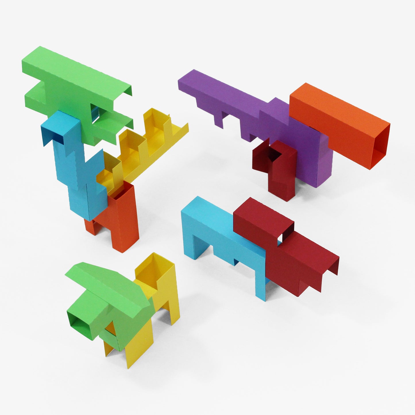 Colorful geometric animal shaped building blocks on a white background