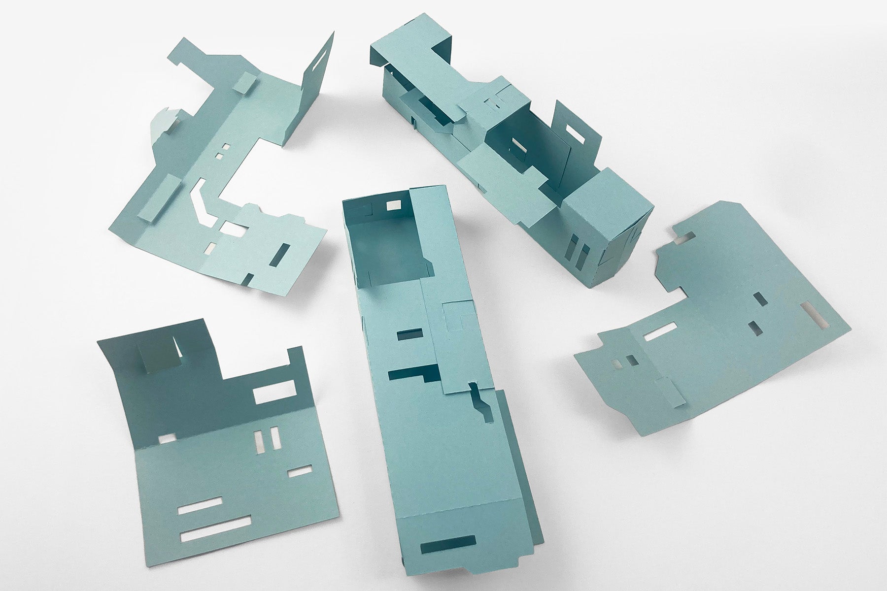 Set of modular paper pieces on a white background