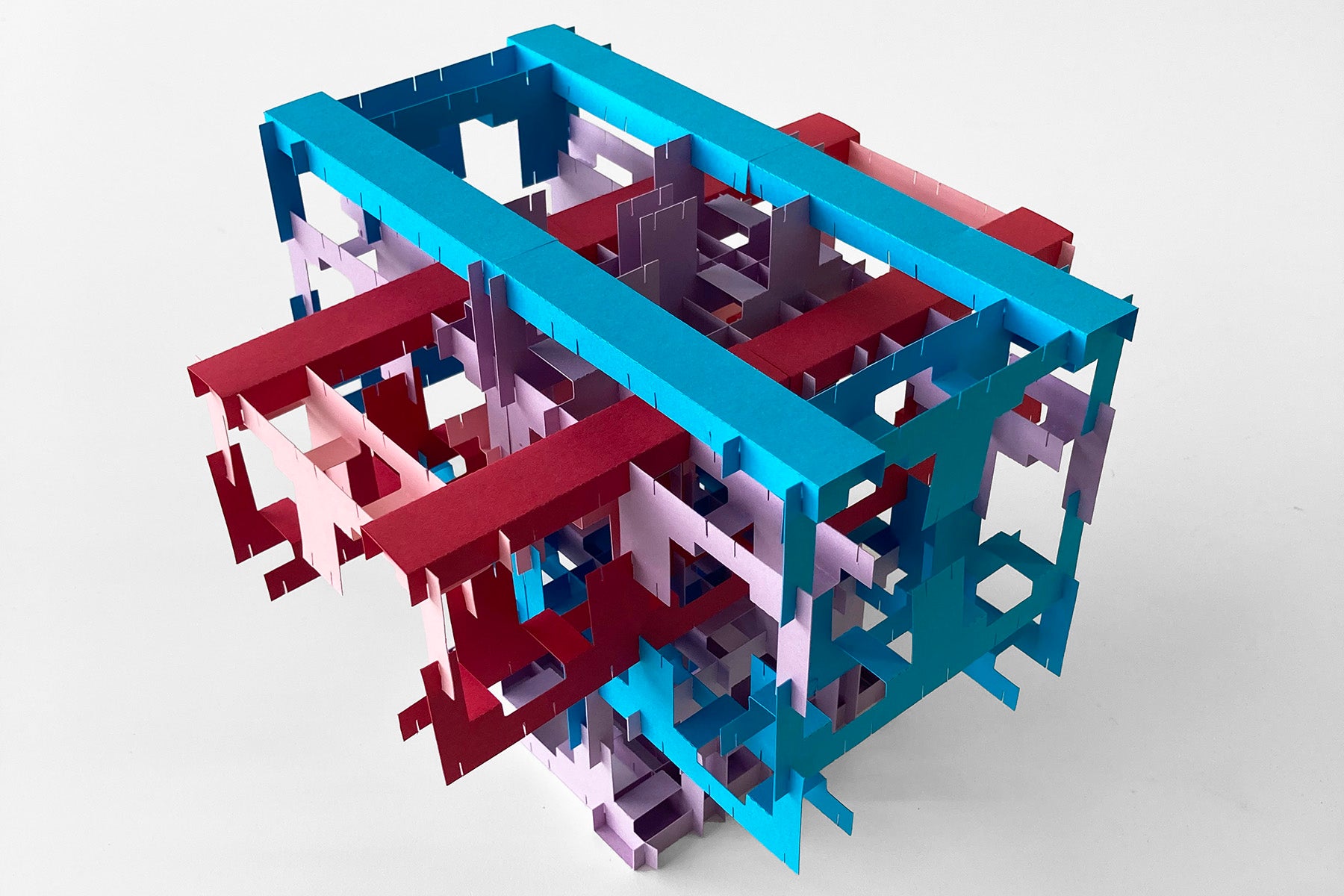 Colorful geometric paper construction on a white background