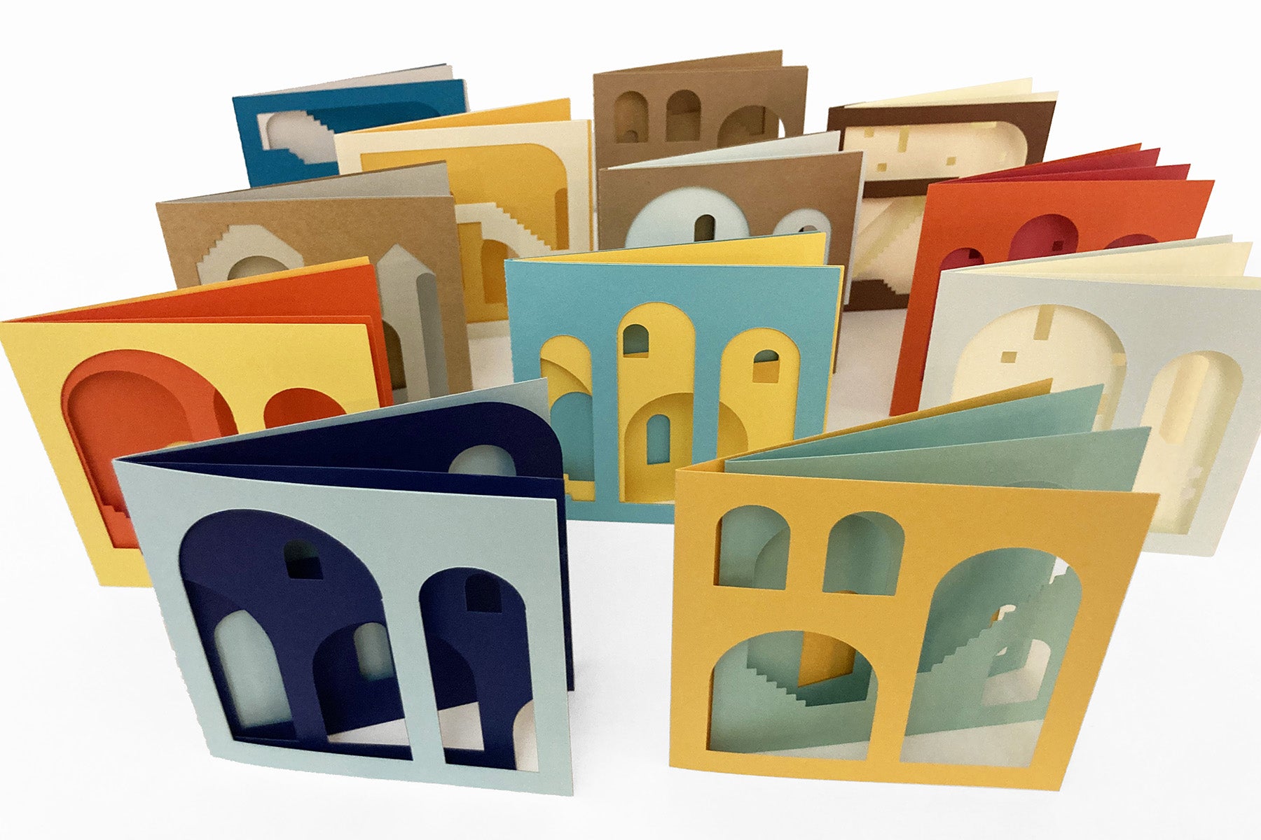 Set of colorful cardstock architectural cutout cards on a white background