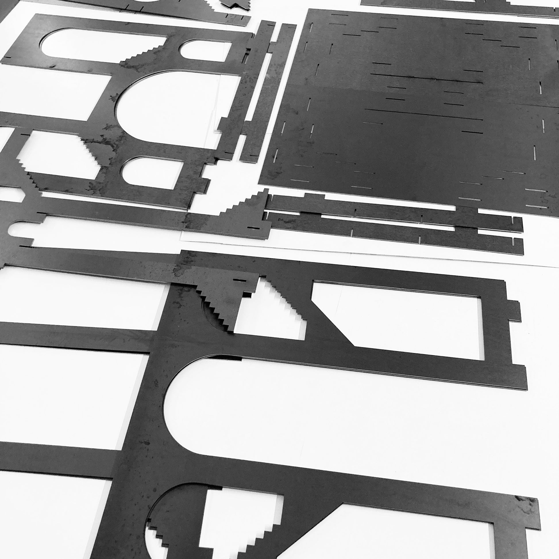 Set of metal sculpture pieces on a white background