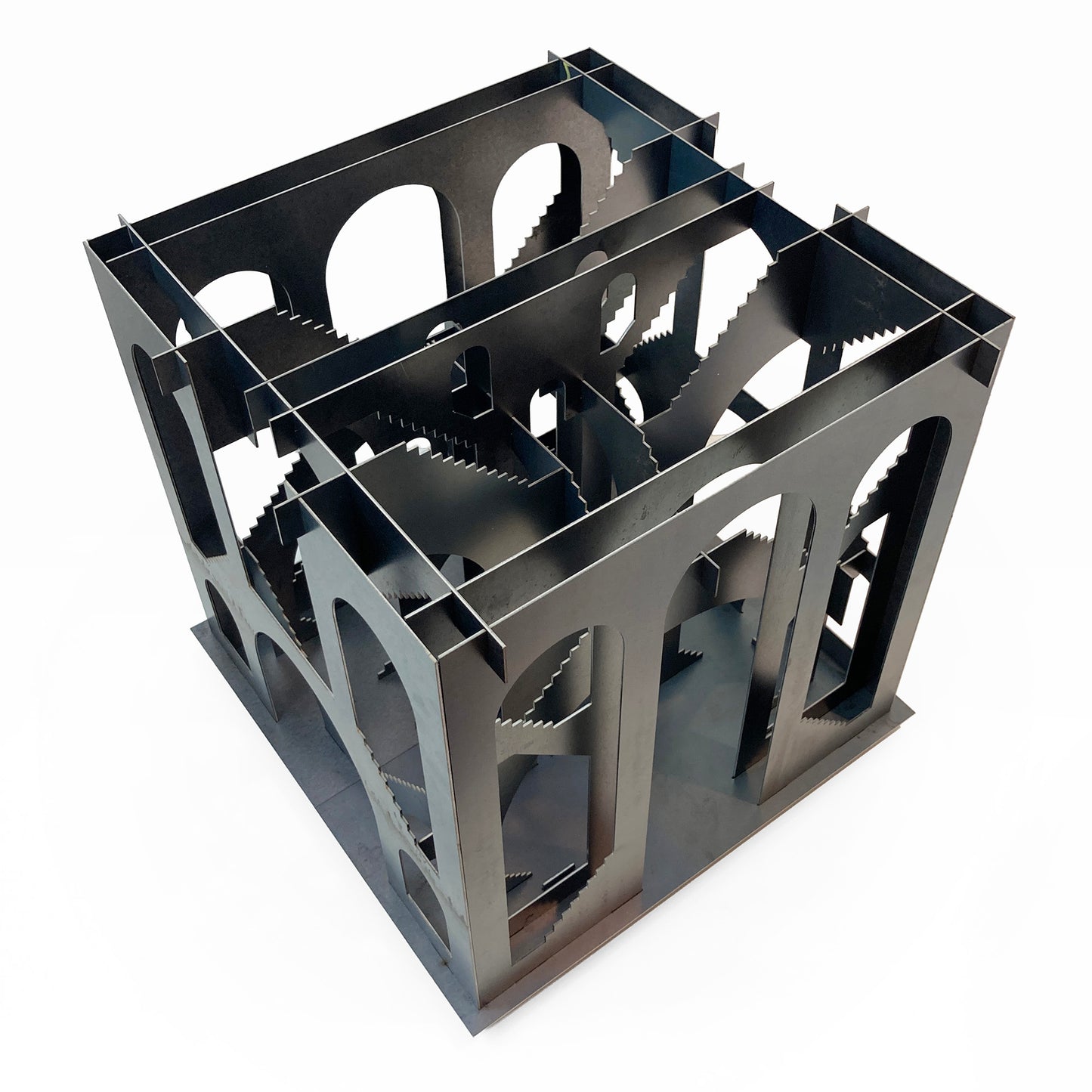 Metallic geometric sculpture on a white background