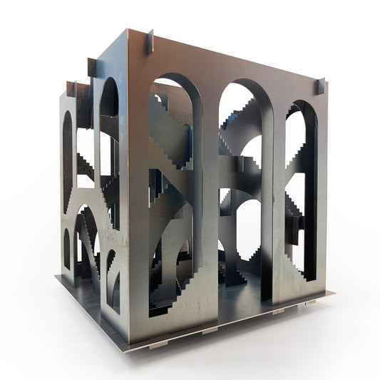 Metallic geometric sculpture on a white background