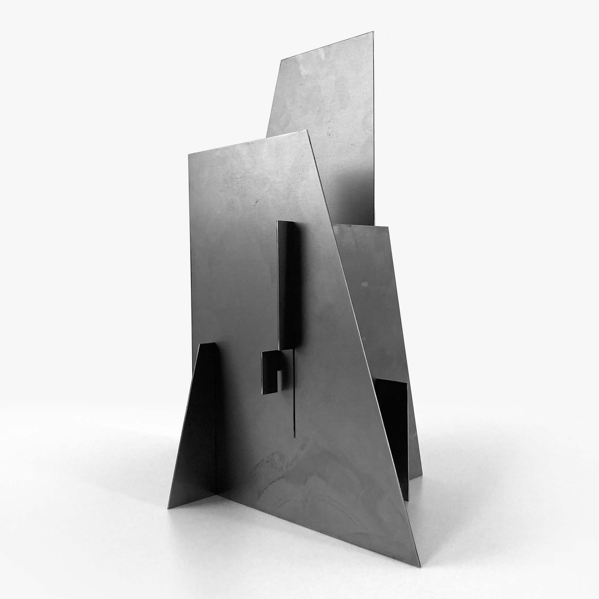Modern metal sculpture on a white background