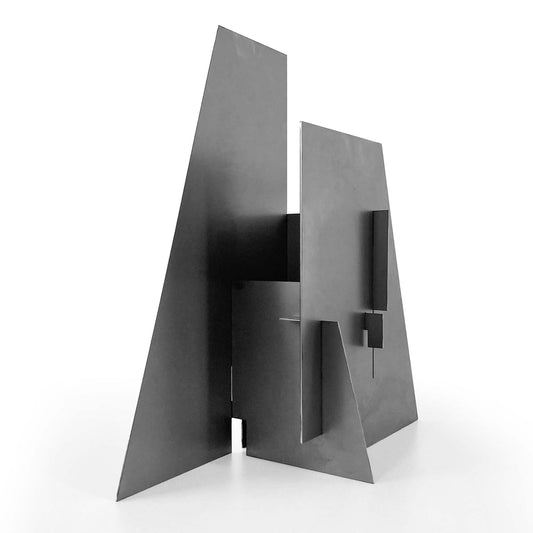 Modern cold rolled steel sculptural lamp on a white background
